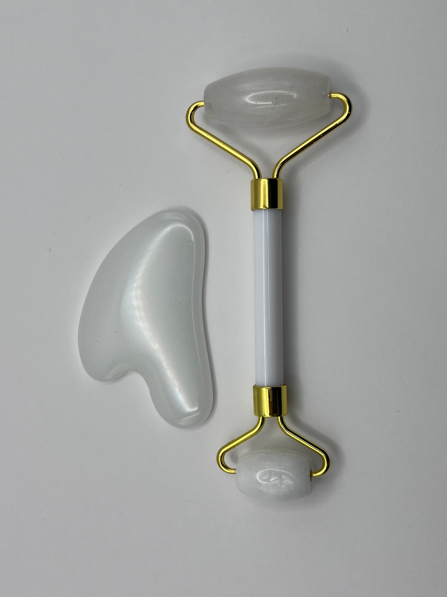 Rodillo facial y gua sha de cuarzo